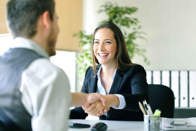 A Human Resources representative welcomes a new employee